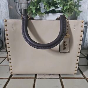 Coach Rogue 25 with Rivets